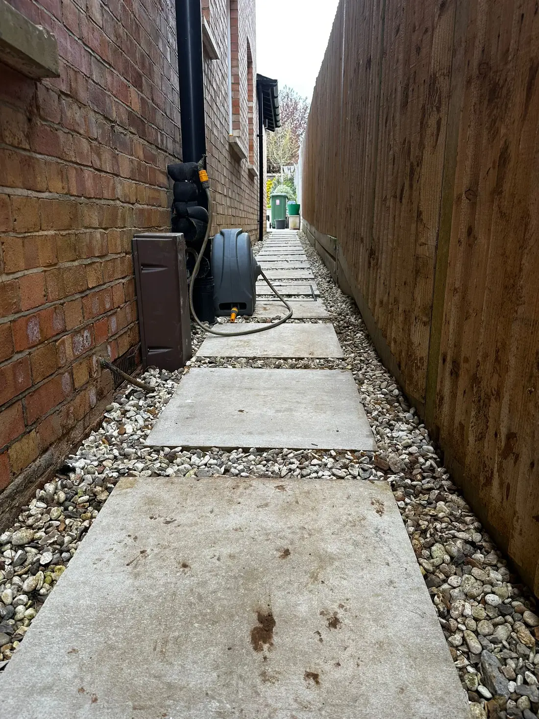Ducting route installed alongside a building and the surface reinstated