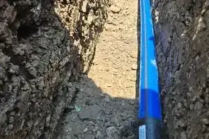Barrier pipe water main in the open trench before backfill